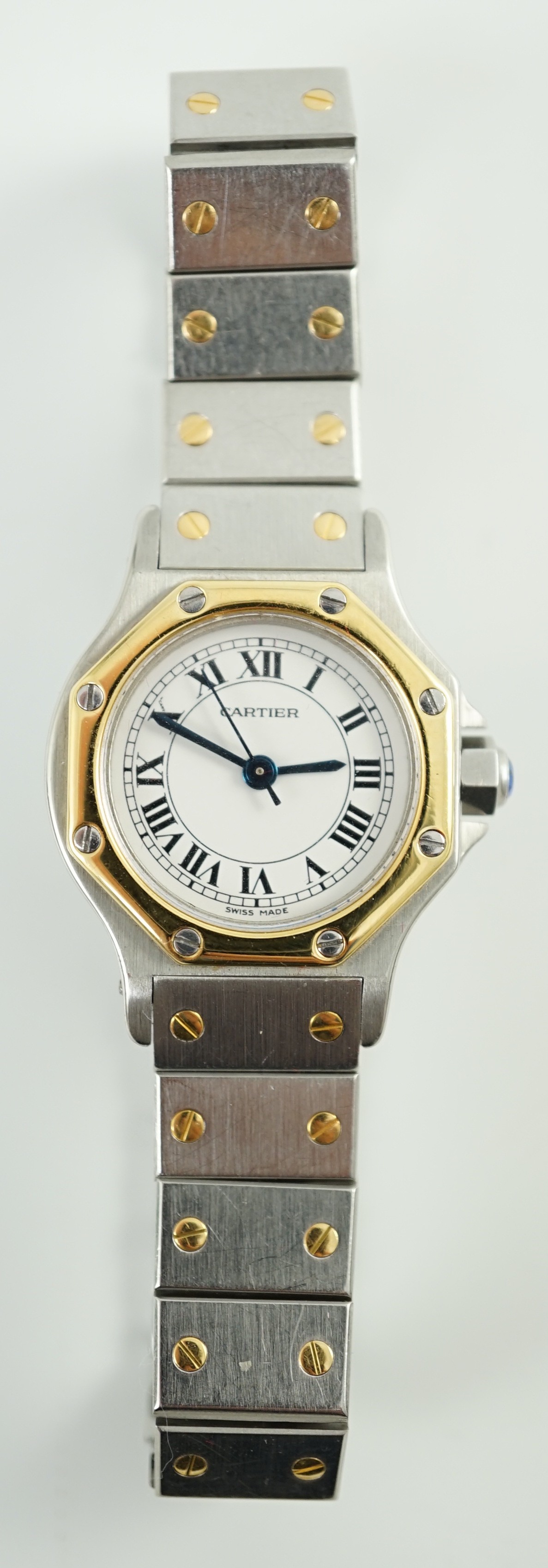 A lady's modern steel and gold Cartier Santos Ronde manual wind wrist watch, on Cartier bracelet with deployment clasp